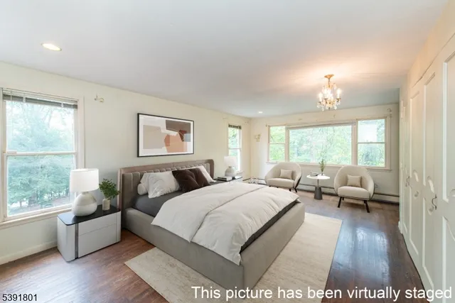 a bed room with a bed and a large window