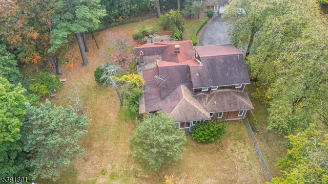 an aerial view of residential house with outdoor space and swimming pool