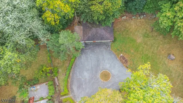a backyard of a house with lots of trees