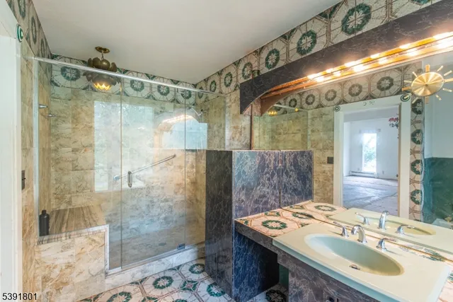 a bathroom with a sink and shower