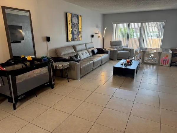 a living room with furniture and a window
