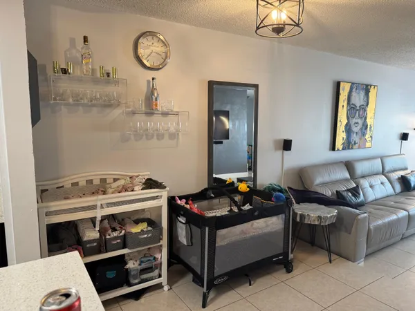 a bedroom with furniture and a mirror