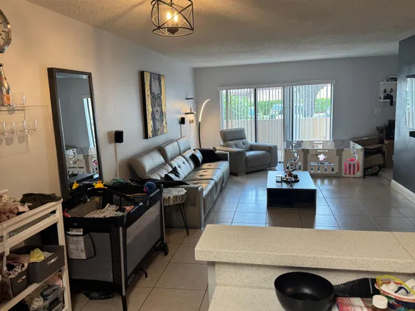 a living room with furniture window and wooden floor