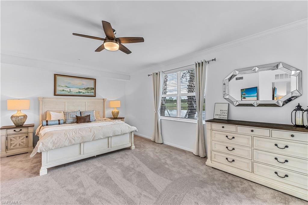 15943 Grassland Lane, Unit 3912 Babcock Ranch, FL 33982 - Photo 11 of 20 a bedroom with a large bed and a dresser