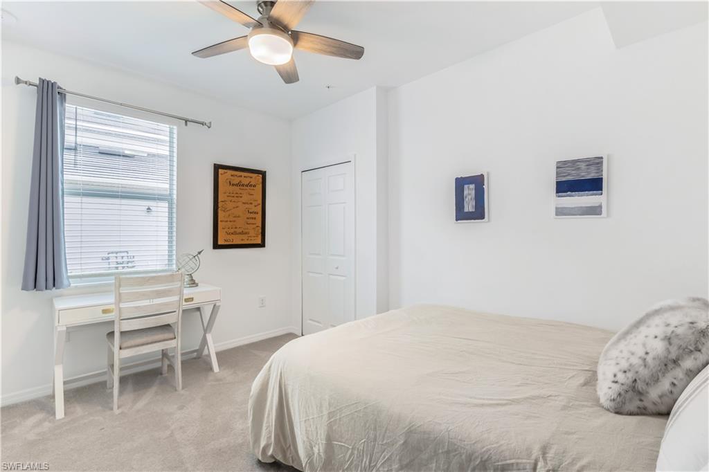 15943 Grassland Lane, Unit 3912 Babcock Ranch, FL 33982 - Photo 16 of 20 a bedroom with a bed and a window