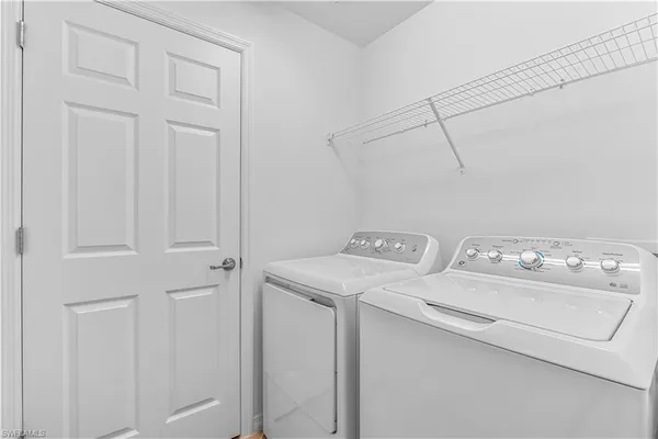 a utility room with dryer and washer