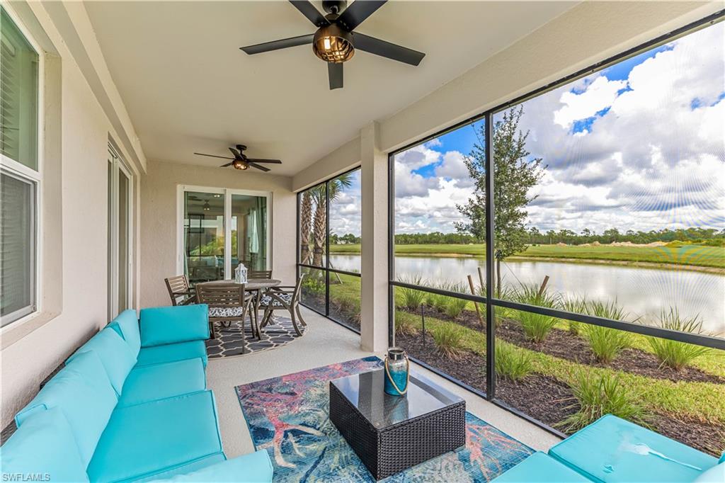 15943 Grassland Lane, Unit 3912 Babcock Ranch, FL 33982 - Photo 2 of 20 a living room with large windows and a table