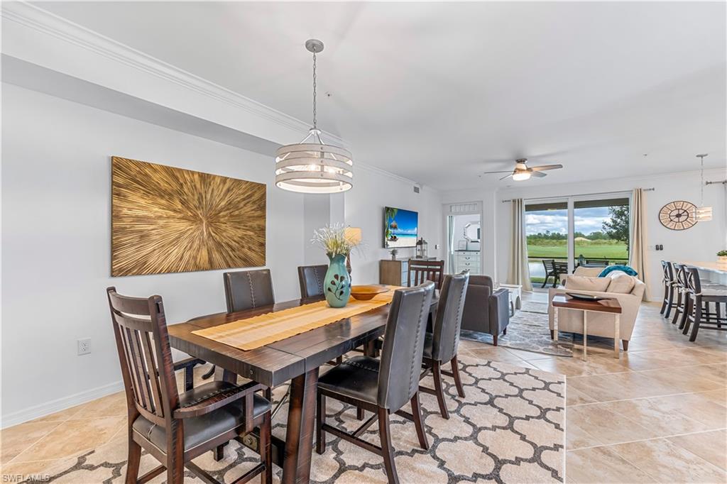15943 Grassland Lane, Unit 3912 Babcock Ranch, FL 33982 - Photo 3 of 20 a view of a dining room with furniture window and wooden floor