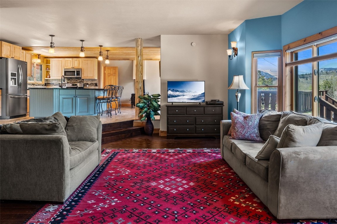 367 G Road Silverthorne, CO 80498 - Photo 12 of 50 a living room with furniture a large window with kitchen view