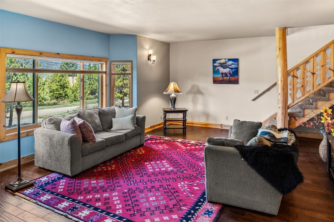 367 G Road Silverthorne, CO 80498 - Photo 13 of 50 a living room with furniture and a floor to ceiling window