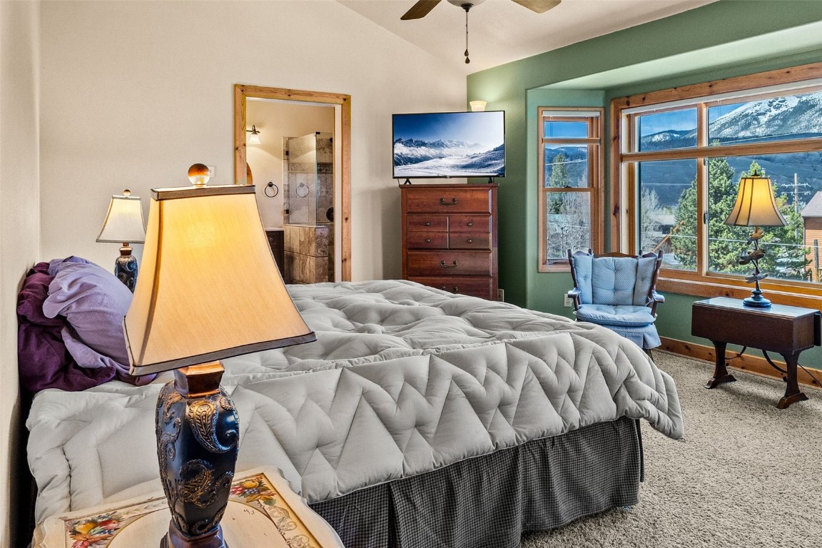 367 G Road Silverthorne, CO 80498 - Photo 18 of 50 a bedroom with a bed and wooden floor