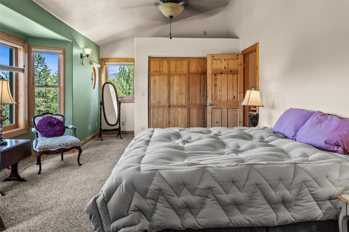 367 G Road Silverthorne, CO 80498 - Photo 20 of 50 a bedroom with a bed and large windows