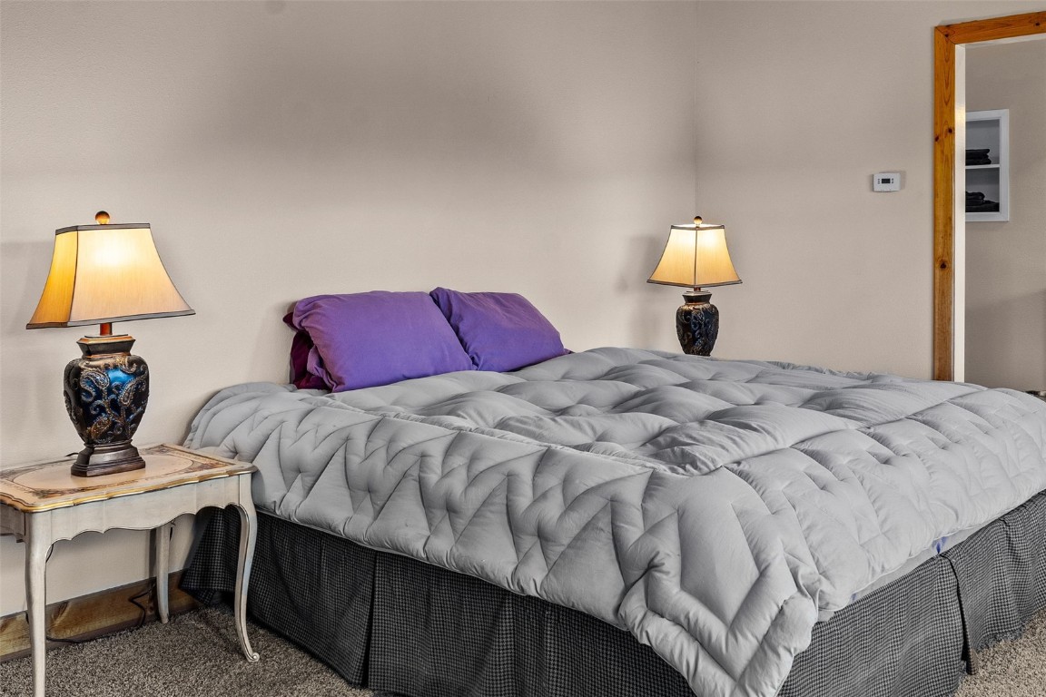 367 G Road Silverthorne, CO 80498 - Photo 22 of 50 a bedroom with a bed and a lamp