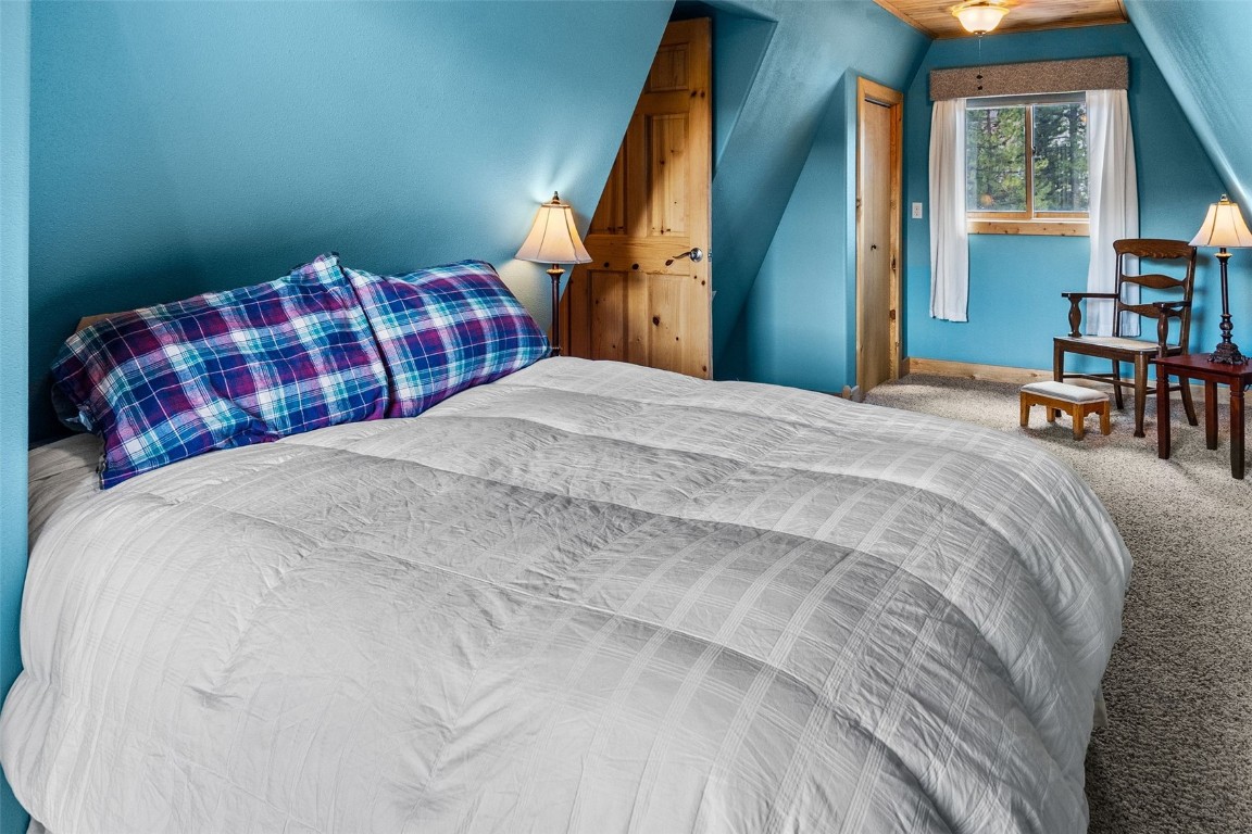 367 G Road Silverthorne, CO 80498 - Photo 29 of 50 a bedroom with a bed and a window