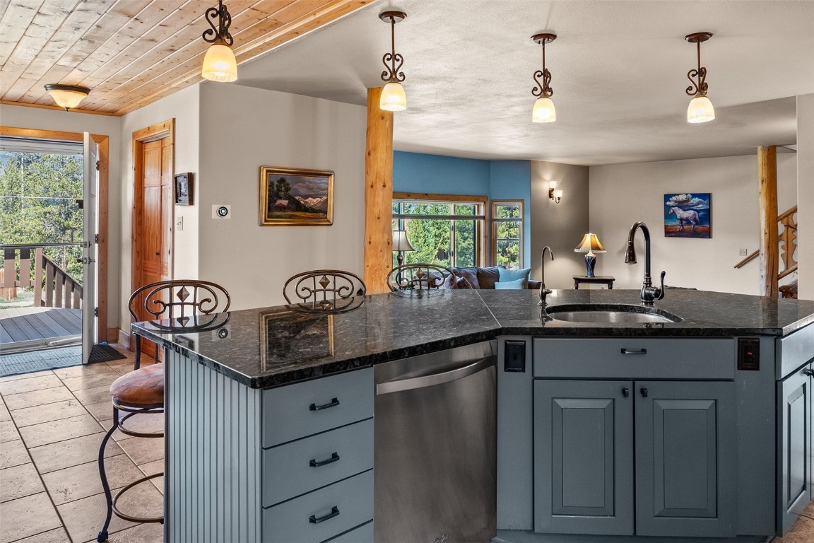 367 G Road Silverthorne, CO 80498 - Photo 6 of 50 a kitchen with stainless steel appliances granite countertop a sink and cabinets