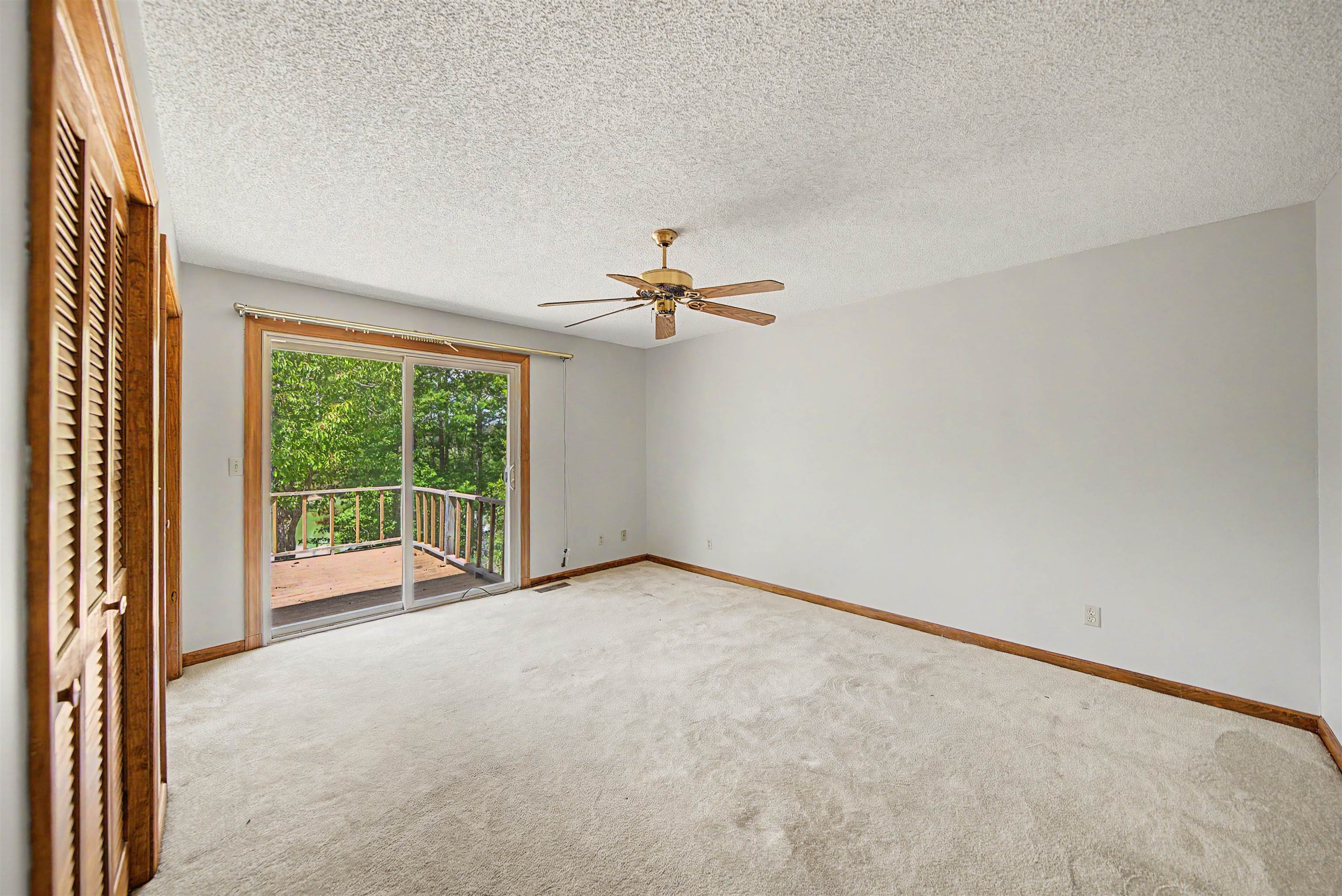 162 Lawton Road Selmer, TN 38375 - Photo 22 of 36 Room with sliding glass door opening to an outdoor deck