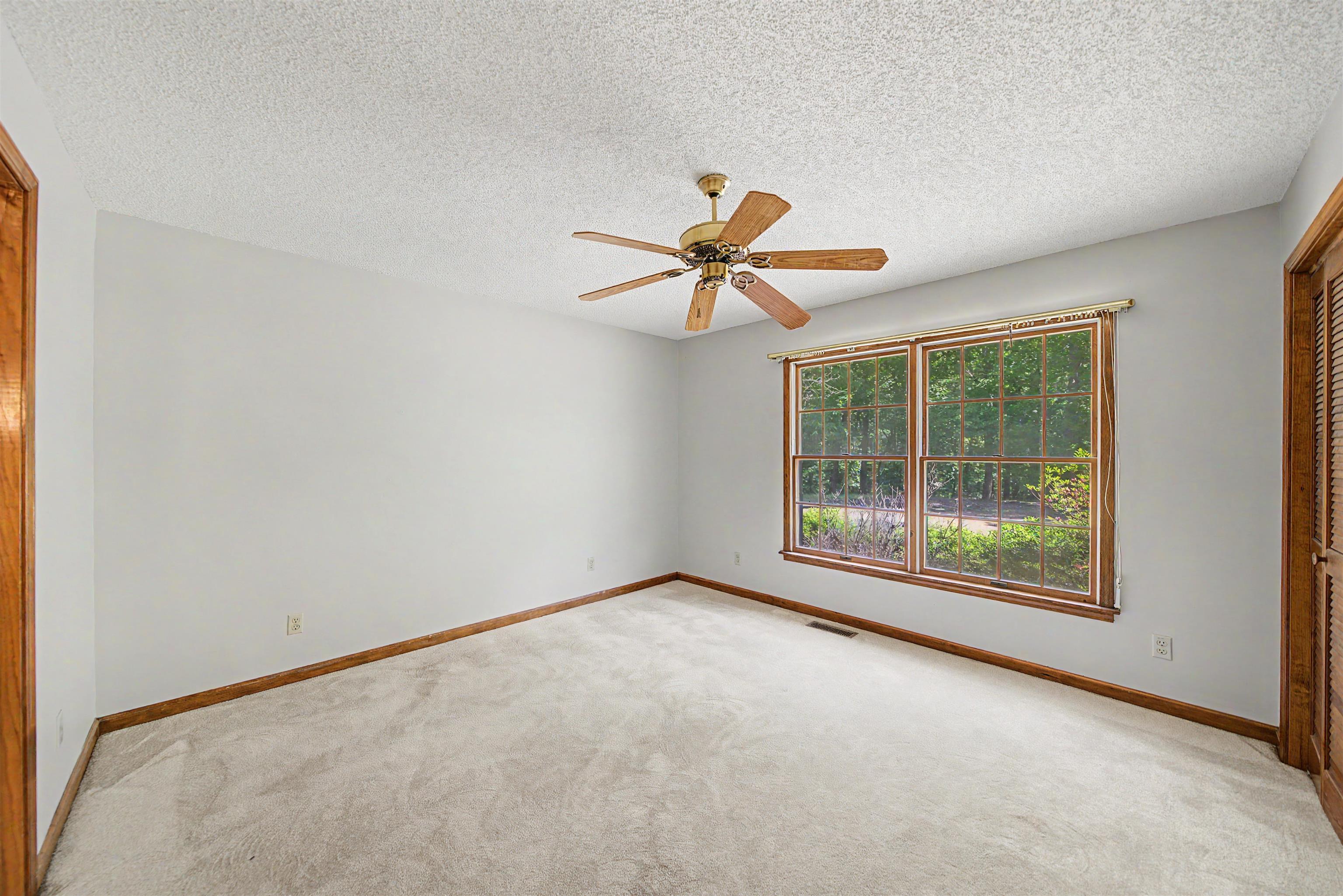 162 Lawton Road Selmer, TN 38375 - Photo 23 of 36 Light gray walls paired with light-toned carpeting