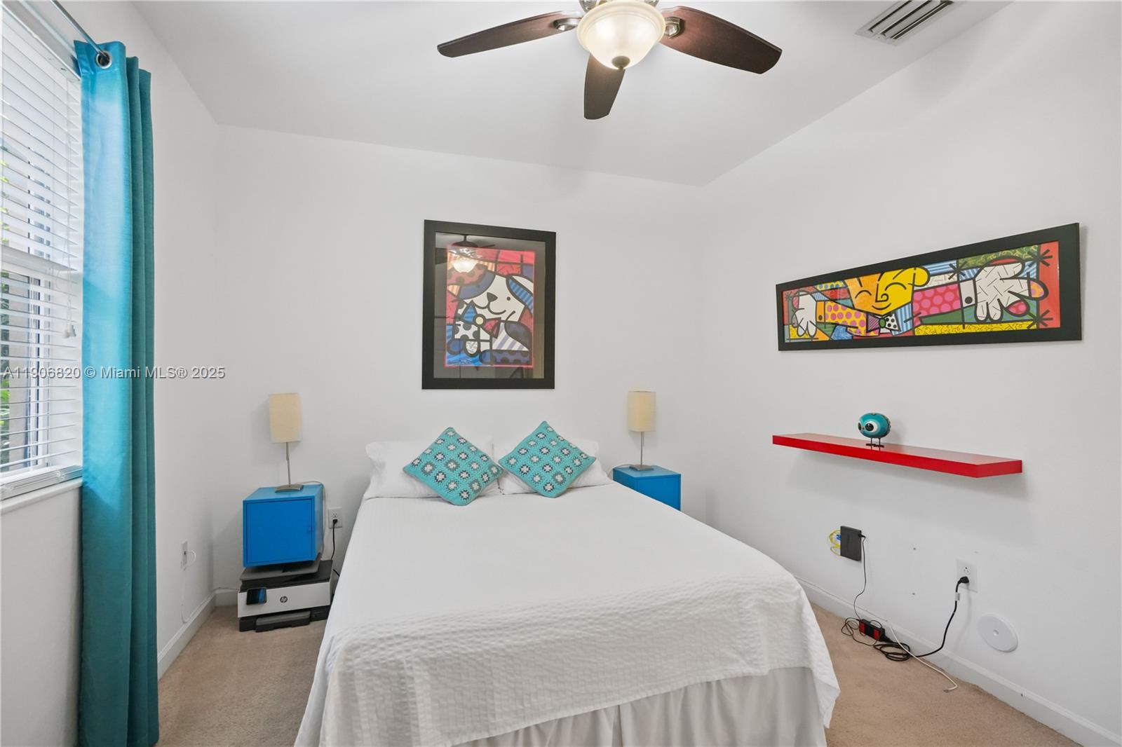 9127 Southwest 171st Court Miami, FL 33196 - Photo 16 of 54 a bedroom with a bed and a painting on the wall