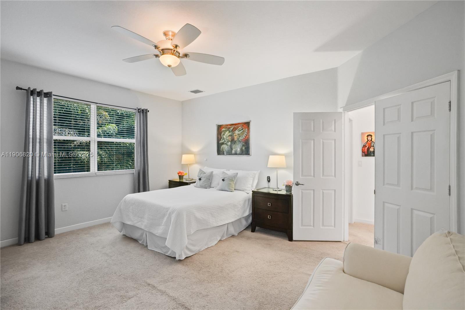 9127 Southwest 171st Court Miami, FL 33196 - Photo 20 of 54 a bedroom with a bed and window