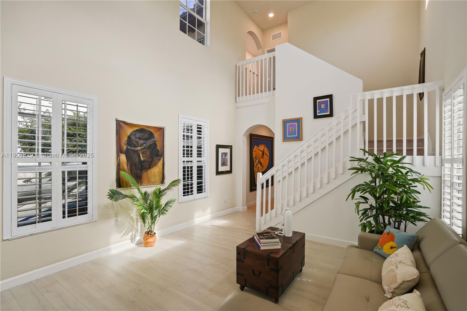 9127 Southwest 171st Court Miami, FL 33196 - Photo 22 of 54 a living room with patio furniture and a potted plant