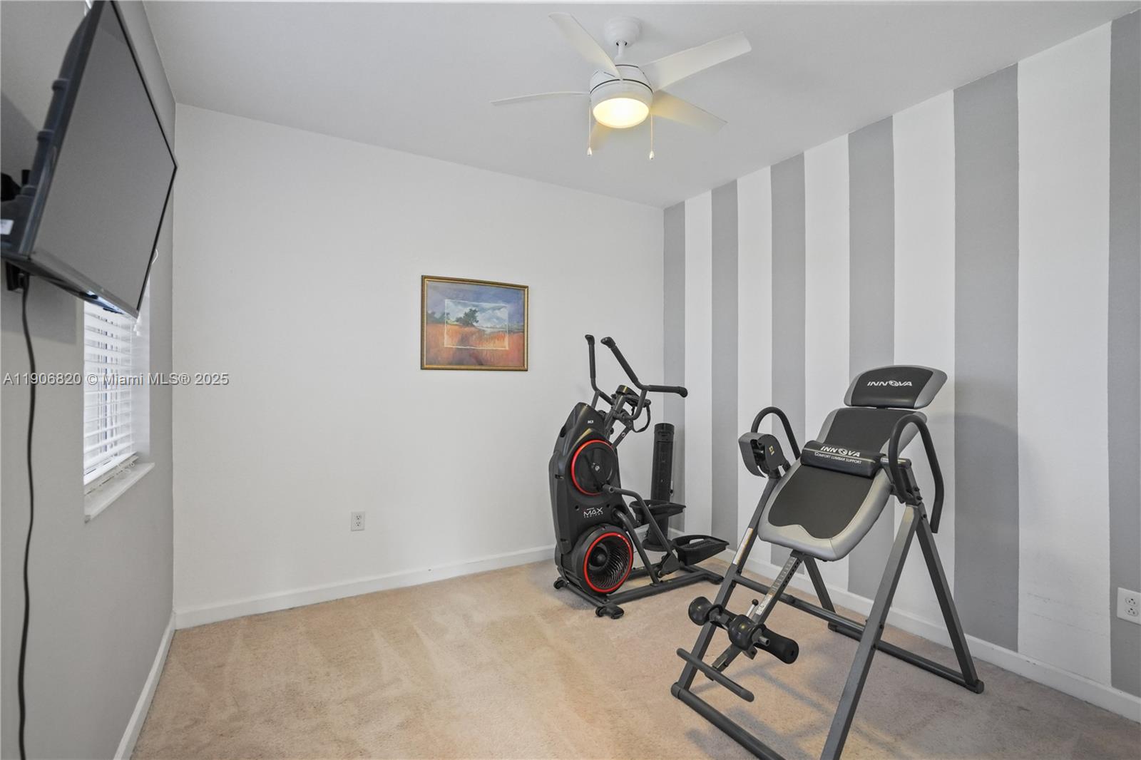 9127 Southwest 171st Court Miami, FL 33196 - Photo 34 of 54 a view of a room with gym equipment