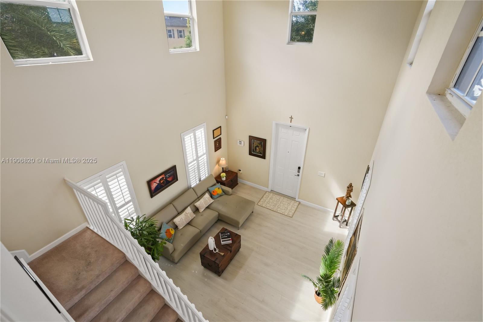 9127 Southwest 171st Court Miami, FL 33196 - Photo 36 of 54 a view of living room with furniture and a clock