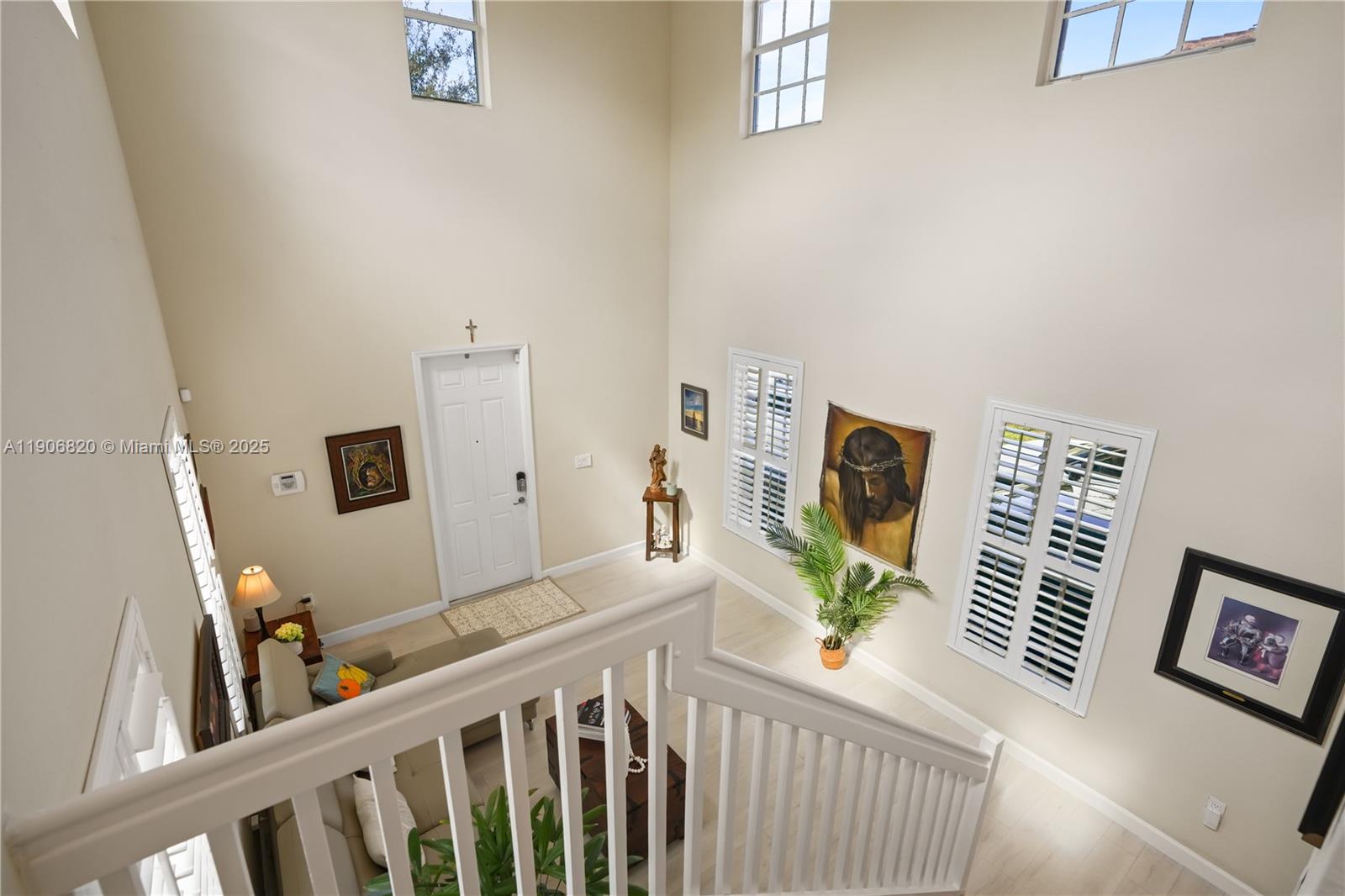 9127 Southwest 171st Court Miami, FL 33196 - Photo 42 of 54 a living room with furniture and a flat screen tv