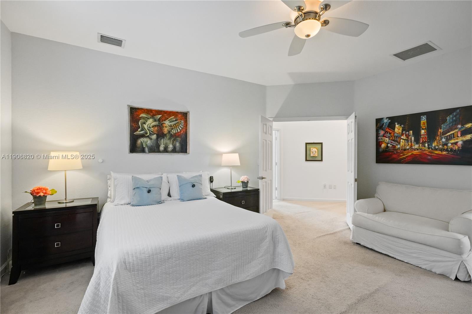 9127 Southwest 171st Court Miami, FL 33196 - Photo 10 of 54 a bedroom with a bed and a couch