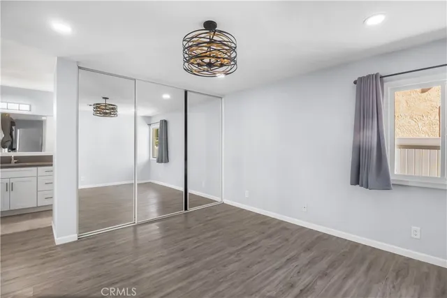 a bathroom with a shower a sink and a mirror