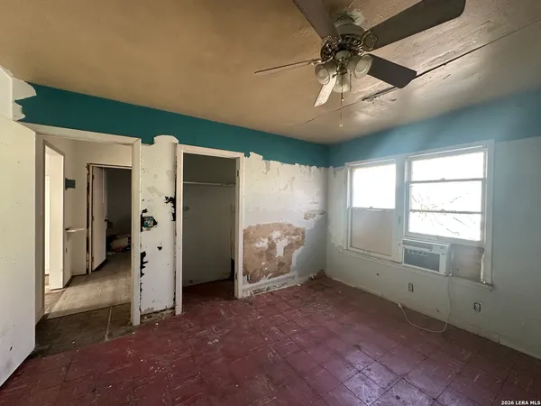 a view of an empty room with a window