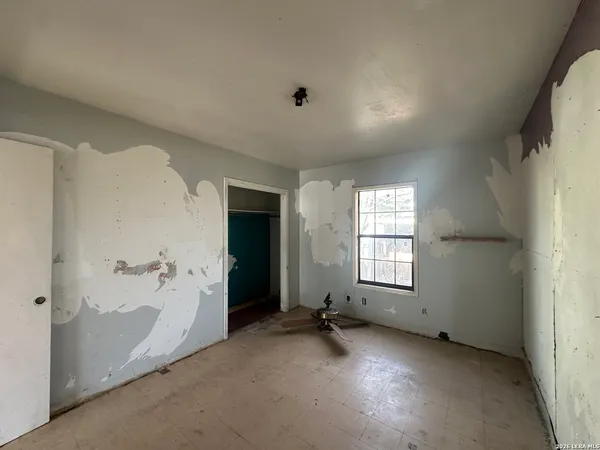 an empty room with windows