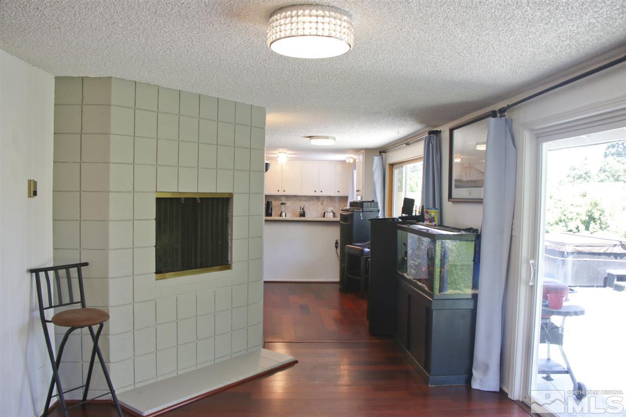 4100 Lakeside Drive Reno, NV 89509 - Photo 16 of 21 a kitchen with stainless steel appliances granite countertop a refrigerator and a stove top oven