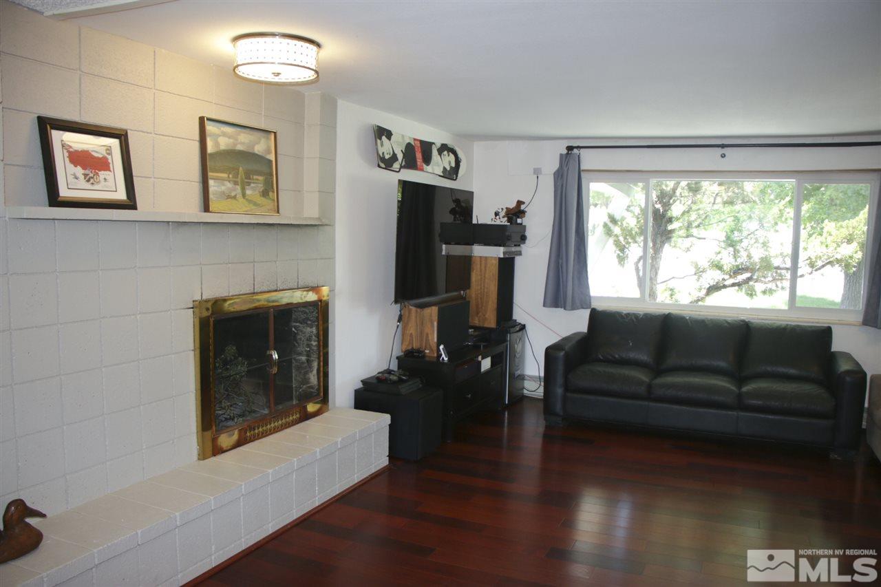 4100 Lakeside Drive Reno, NV 89509 - Photo 17 of 21 a living room with furniture flat screen tv and a fireplace
