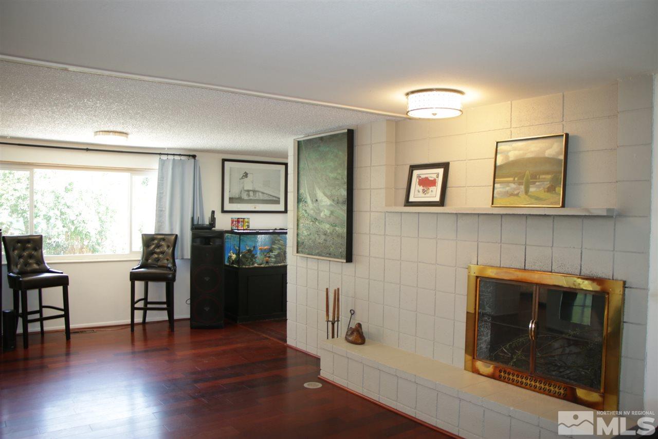 4100 Lakeside Drive Reno, NV 89509 - Photo 19 of 21 a living room with furniture and a fireplace