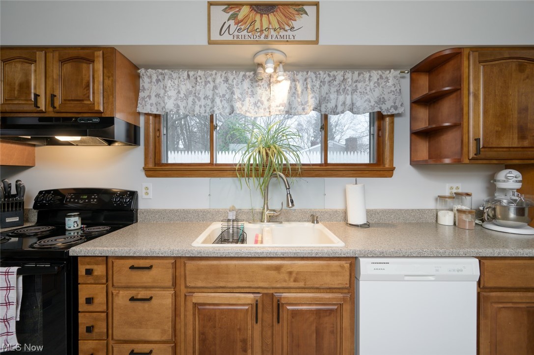 1165 Meadowview Road Kent, OH 44240 - Photo 11 of 40 Kitchen featuring sink, electric range, and white dishwasher