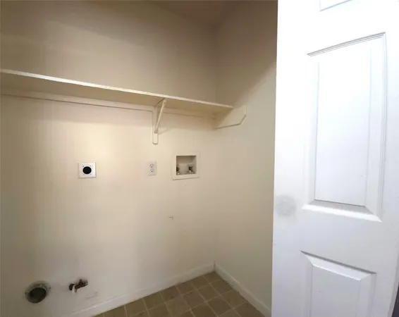 a kitchen with a stove a sink and a microwave