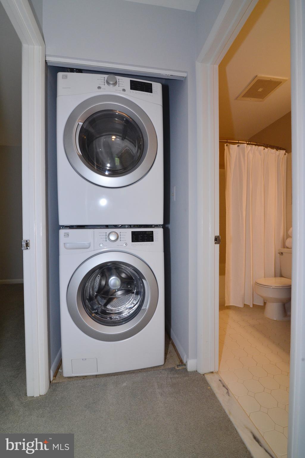 11128 Harbor Court Reston, VA 20191 - Photo 28 of 44 Full-sized, stacked washer and dryer in the unit.