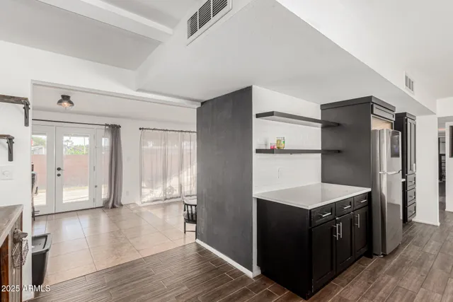 a kitchen with stainless steel appliances a refrigerator and a stove