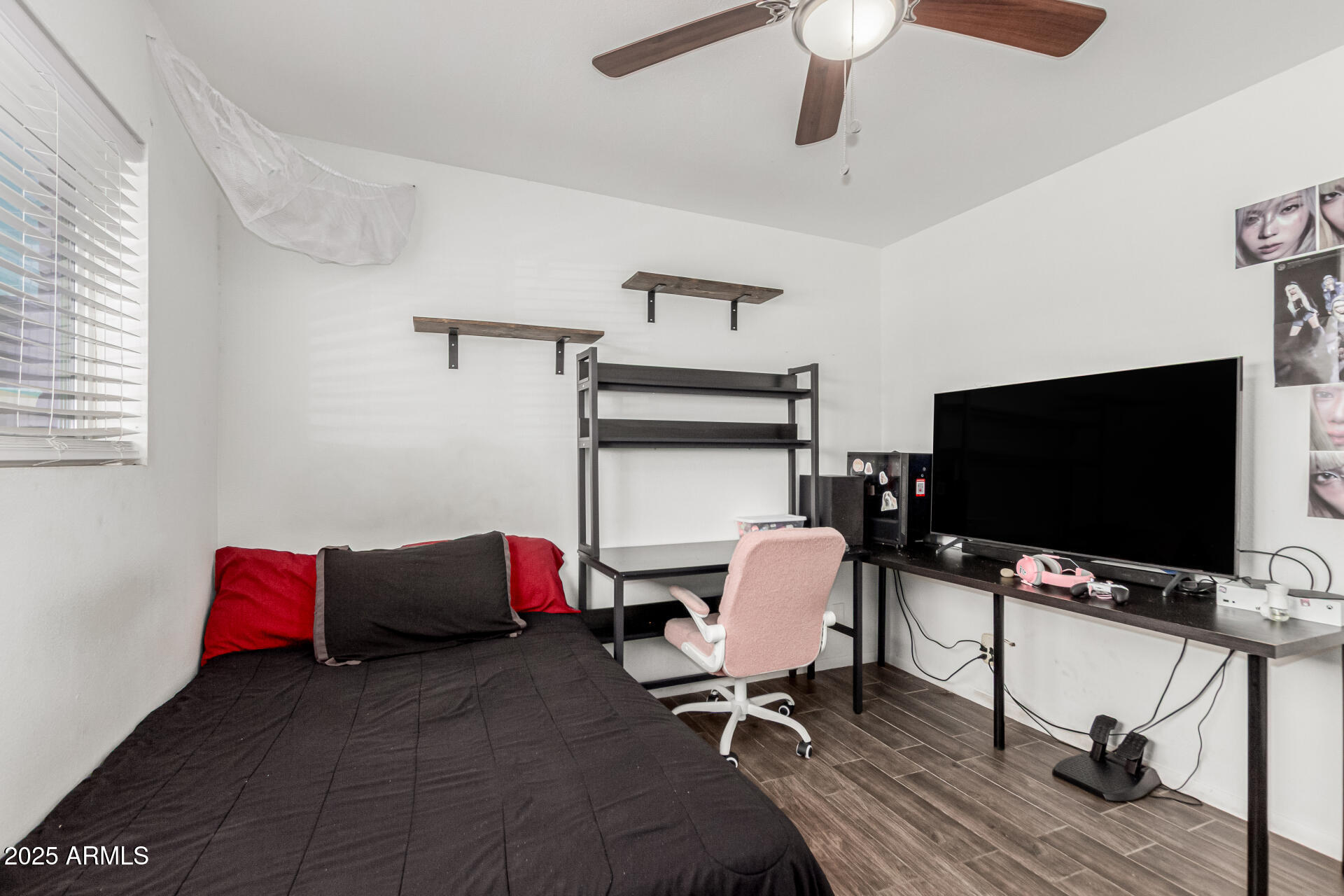 3701 West Griswold Road Phoenix, AZ 85051 - Photo 22 of 30 a bedroom with a bed and a flat screen tv