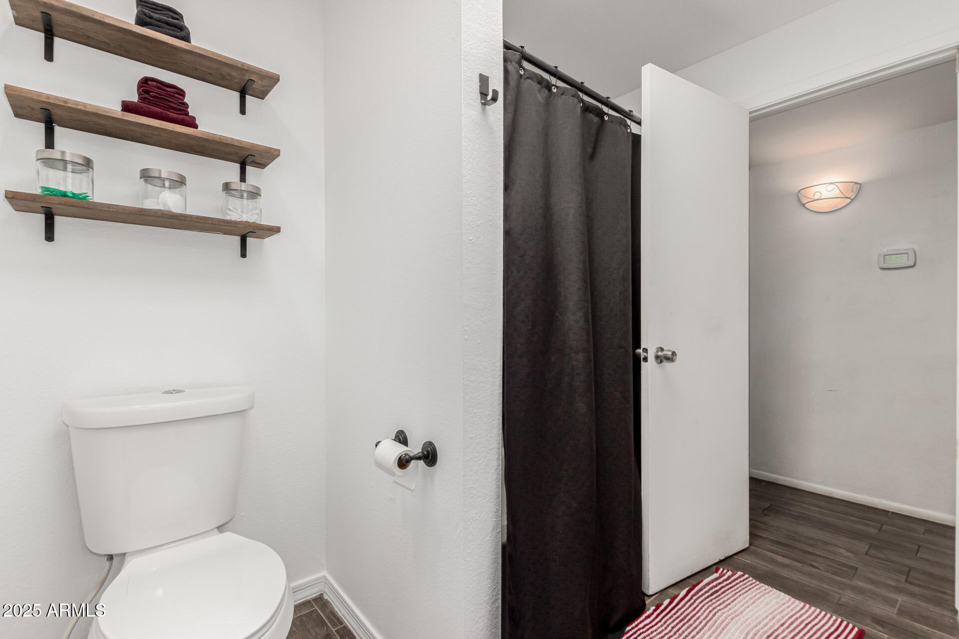 3701 West Griswold Road Phoenix, AZ 85051 - Photo 24 of 30 a bathroom with a toilet and a shower