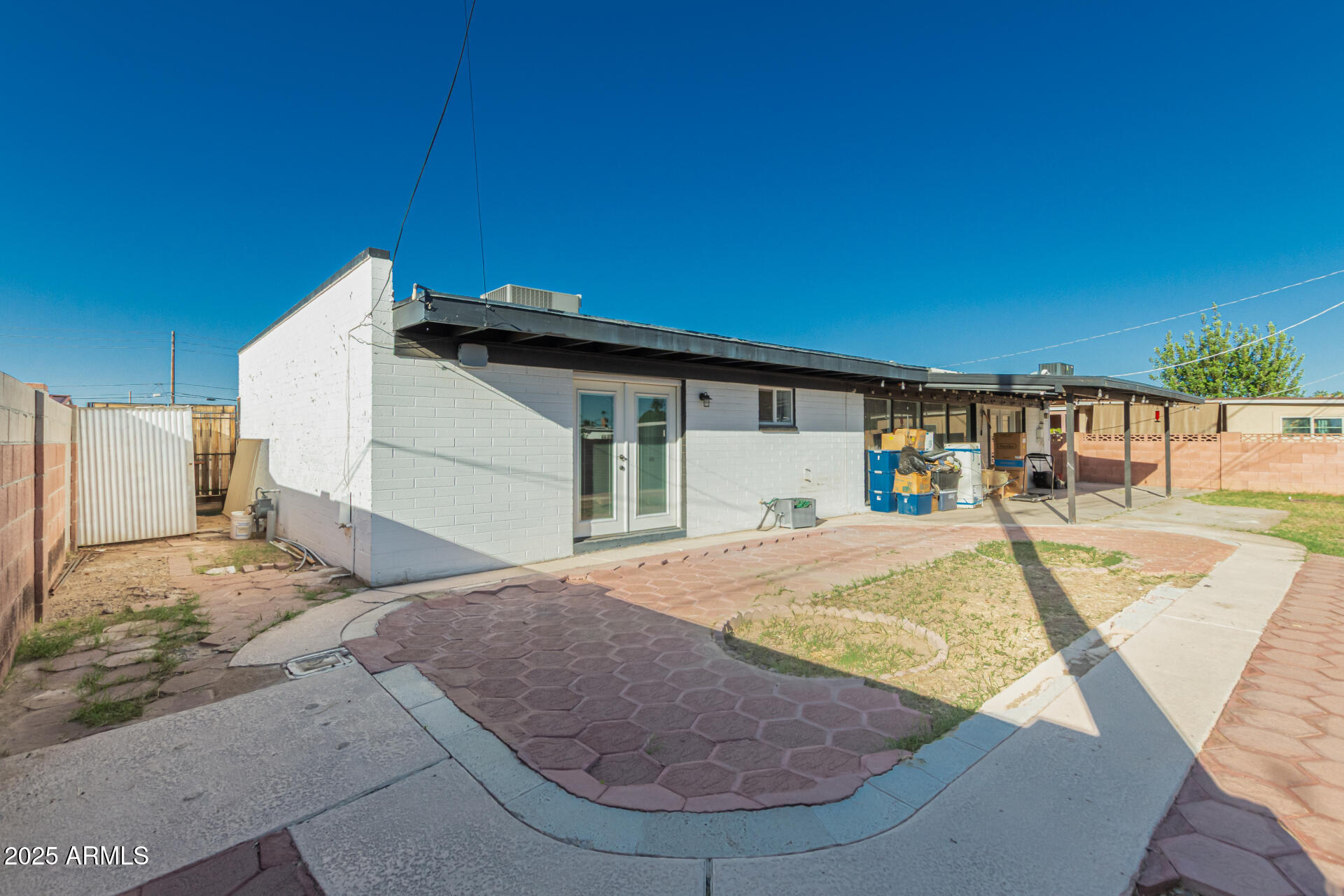 3701 West Griswold Road Phoenix, AZ 85051 - Photo 29 of 30 a view of a house with swimming pool and sitting area
