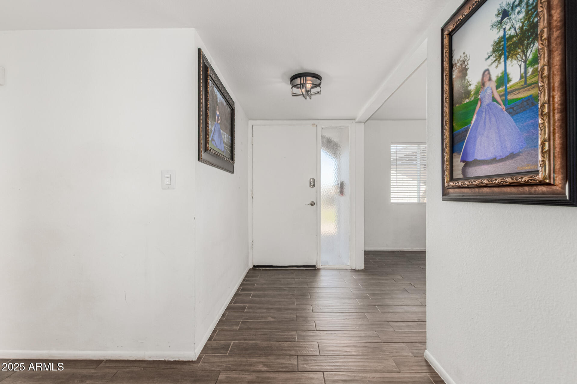 3701 West Griswold Road Phoenix, AZ 85051 - Photo 6 of 30 a view of a hallway with wooden floor