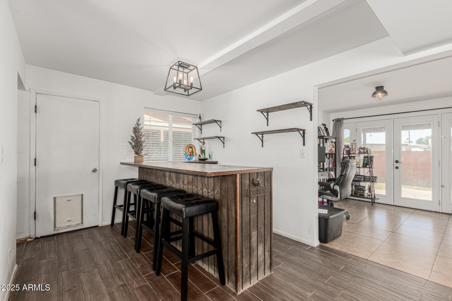 3701 West Griswold Road Phoenix, AZ 85051 - Photo 10 of 30 a view of a livingroom with furniture and wooden floor