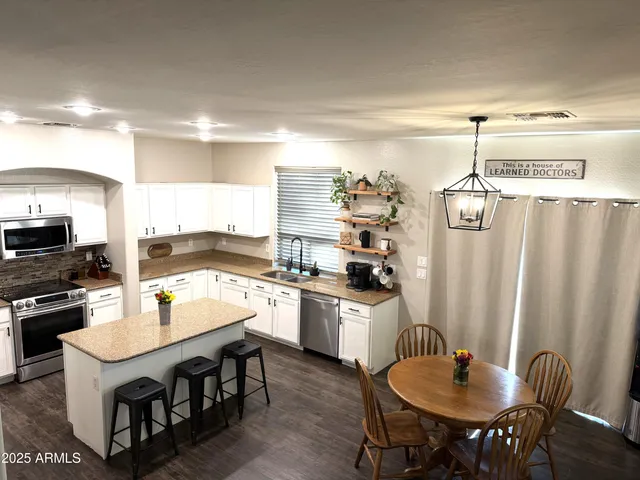 a kitchen with a stove and a microwave