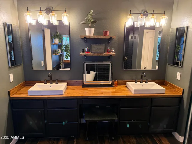 a bedroom with bed tv and window