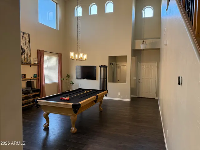 a living room with furniture flat screen tv and a fireplace