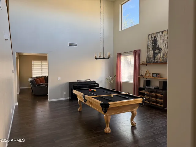 a view of a livingroom with furniture and a flat screen tv