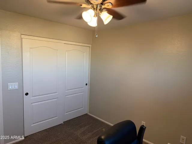 a room with wooden floor and a window
