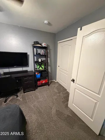 a bedroom with bed and a window