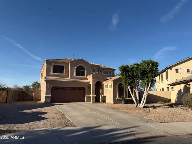 a front view of a house with parking space